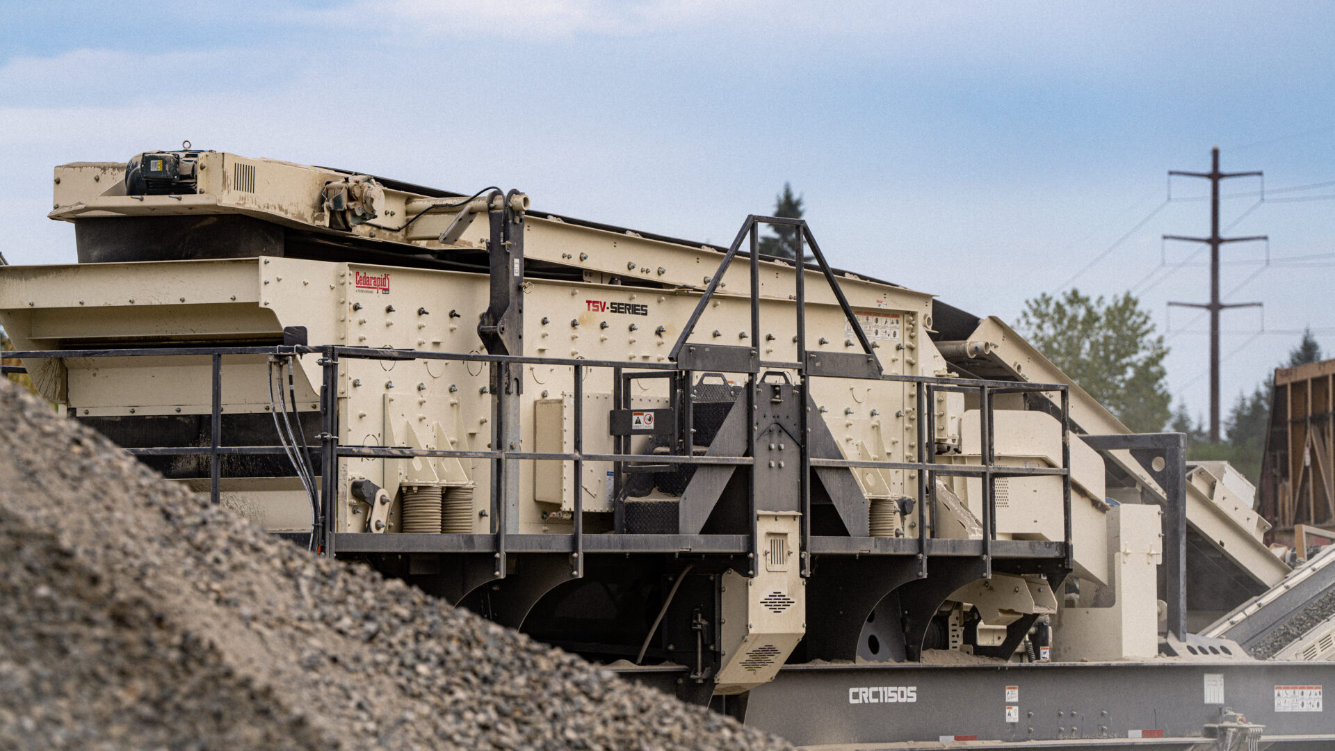 Close-up of a Cedarapids TSV Series portable screen plant used for aggregate screening in a mobile crushing spread, mounted on a CRC1150S chassis.