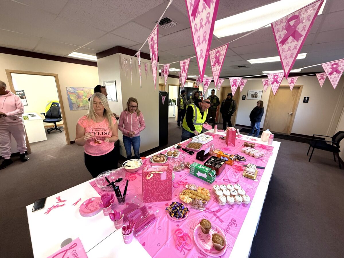 People participating in a breast cancer bake sale